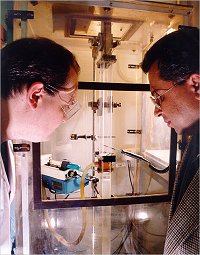 Dr Ashok Bhattacharya, and a research assistant examine the process