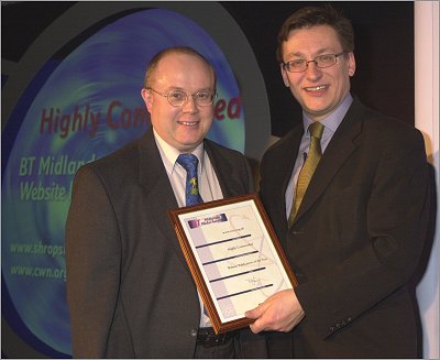 Chris Studman collects the award from Tim Johns, BT director of media relations