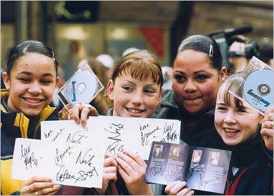 Hear'Say visit to Coventry - Happy Fans with Autographs - 29 March 2001 [photo by Avon Studios]