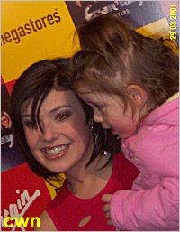 Hear'Say - Kymberley Marsh holding a baby - Coventry - 29 March 2001 [photo by Chris Studman]