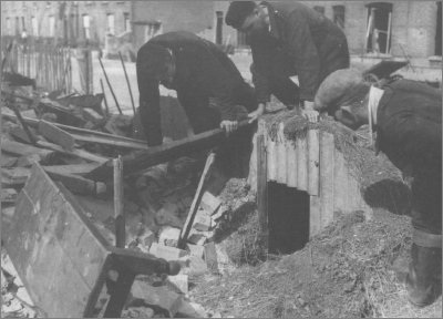 Working clearing the riubble after the raid